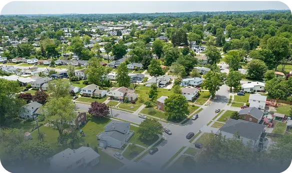 An aerial shot of a neighborhood full on single-family homes.